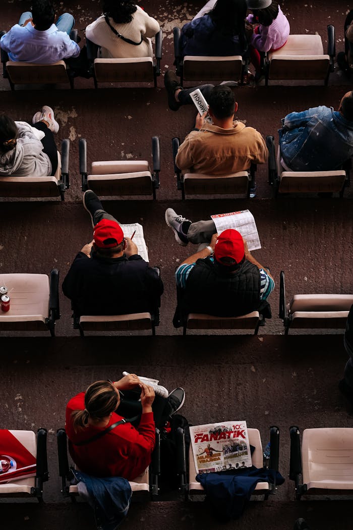 Top view of people sitting in a stadium in Ankara, focusing on vibrant details.